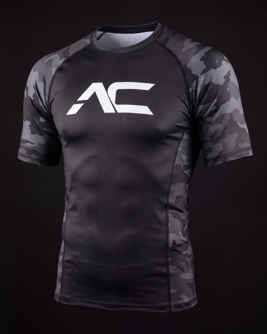 Compression rashguard with grayscale camo sleeves and the white AC mark